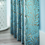 Graber Artisan Drapes with a blue floral pattern